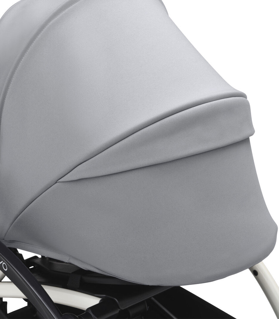 Stokke® YOYO3® 0+ Stone. White Frame. Canopy ventilation closed. Close-up. Angled. galery image 12